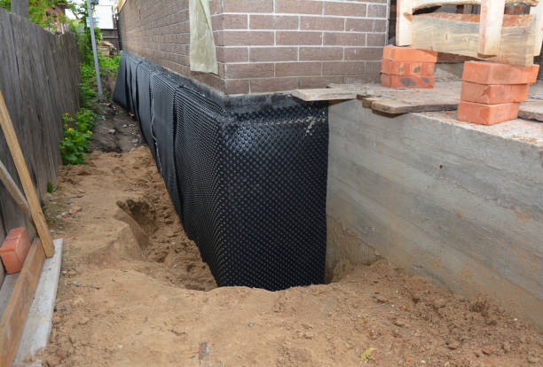 SJ Waterproofing Pros technician performing targeted Waterproofing assessment in Conover, OH